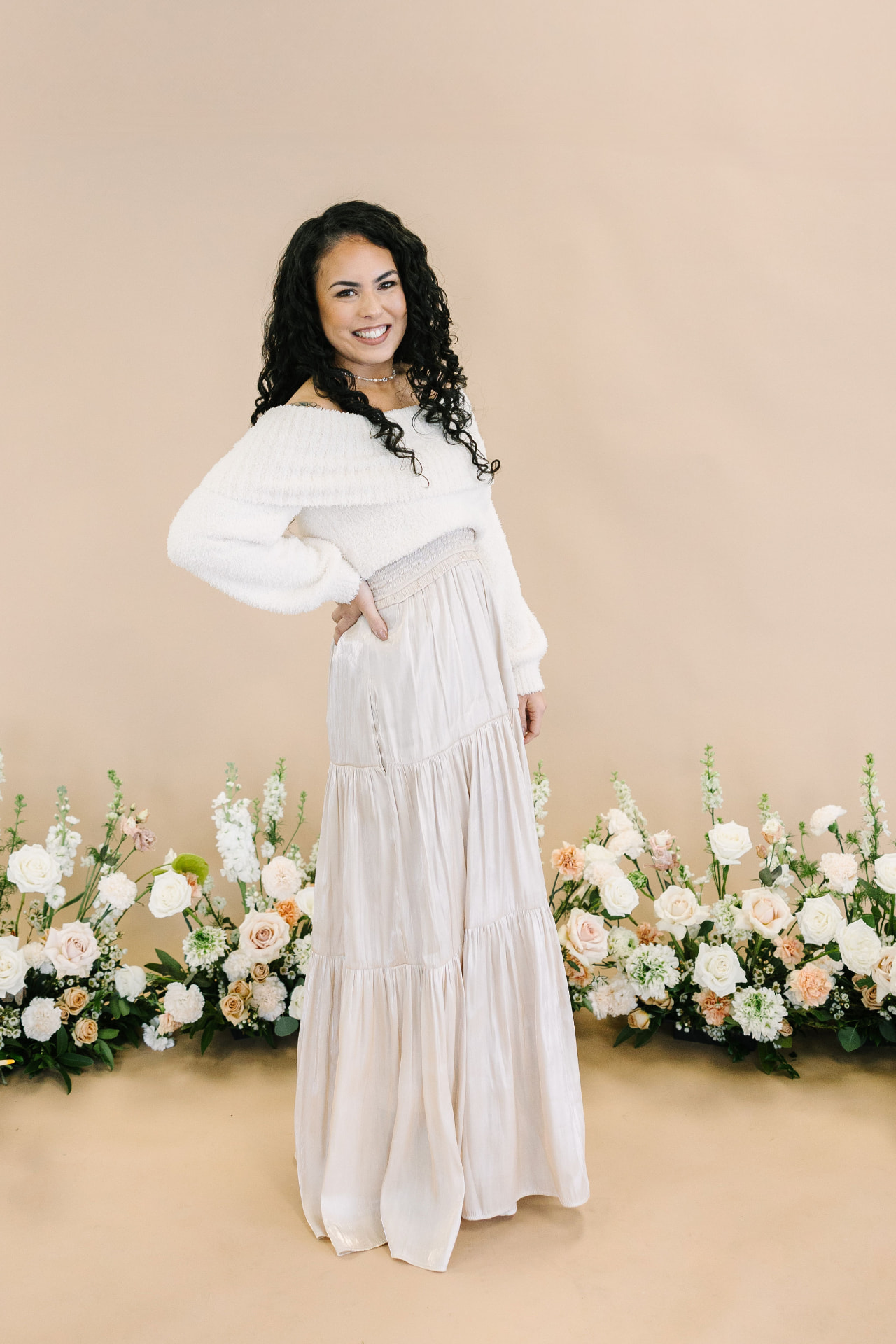 Founder of Oasis Weddings and Events in a sunlit garden
